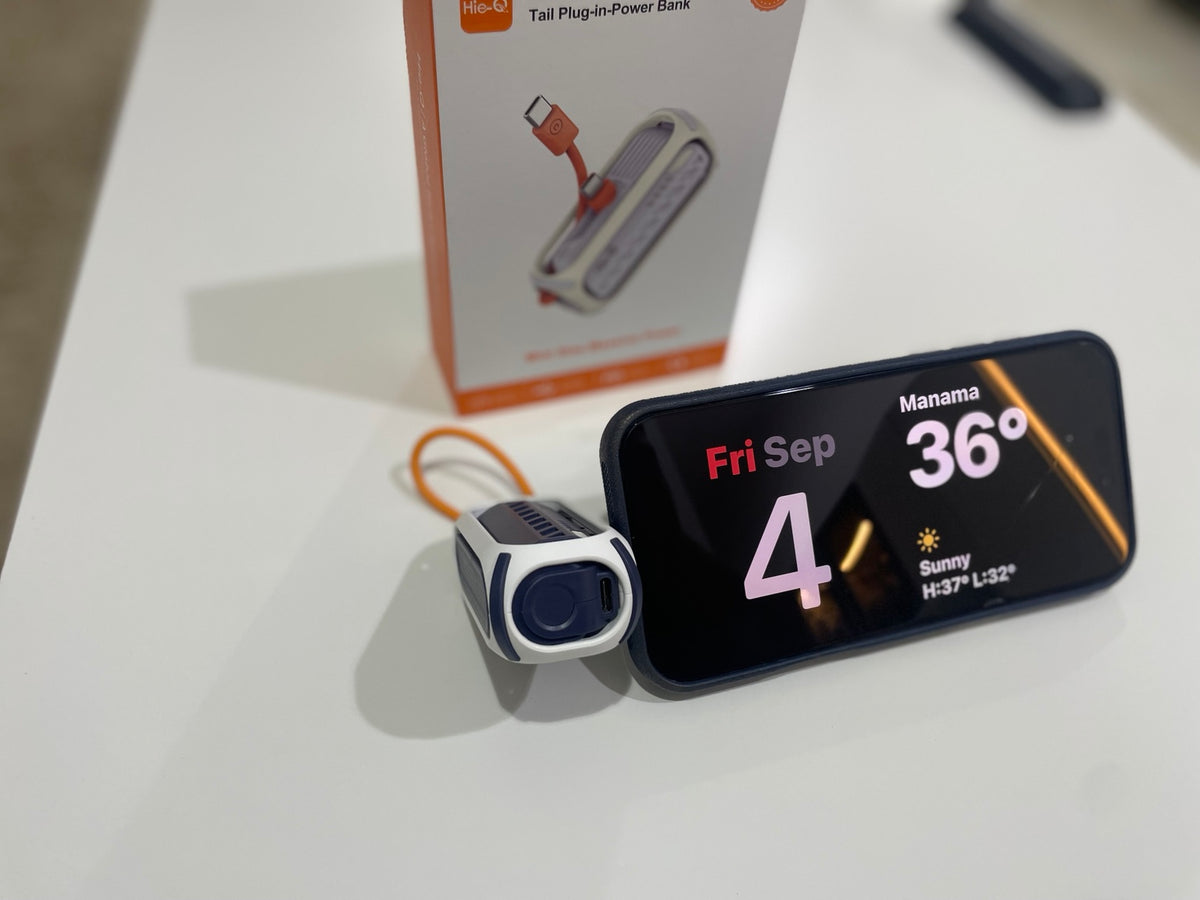 HieQ QuickMini 5K power bank used as a phone stand