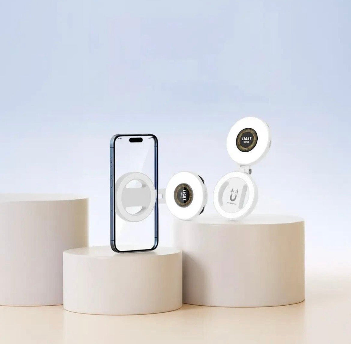 White W50 MagSafe magnetic LED fill light shown folded and extended beside a smartphone